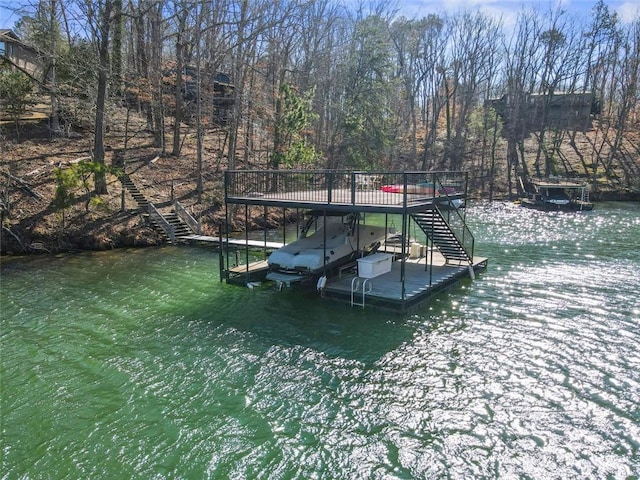 dock area featuring boat lift and stairway