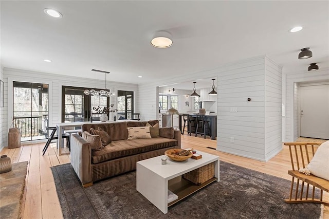 living room with hardwood / wood-style flooring and recessed lighting