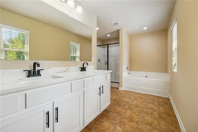 bathroom featuring shower with separate bathtub and vanity