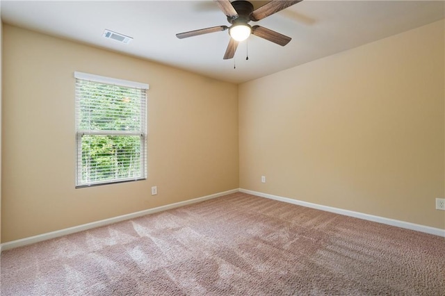 unfurnished room featuring ceiling fan and light colored carpet