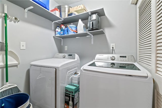 laundry area with washing machine and dryer and laundry area