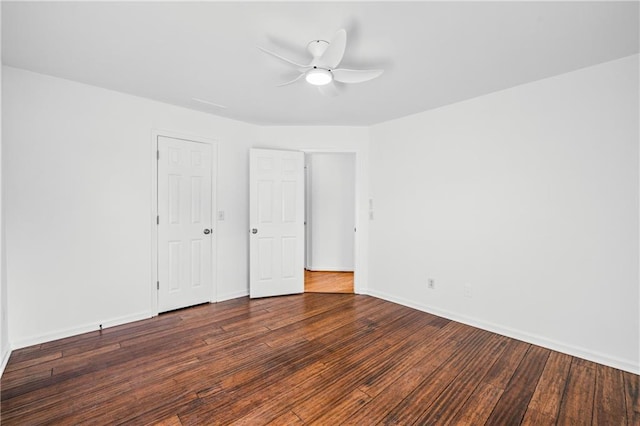 unfurnished bedroom with hardwood / wood-style flooring, baseboards, and ceiling fan