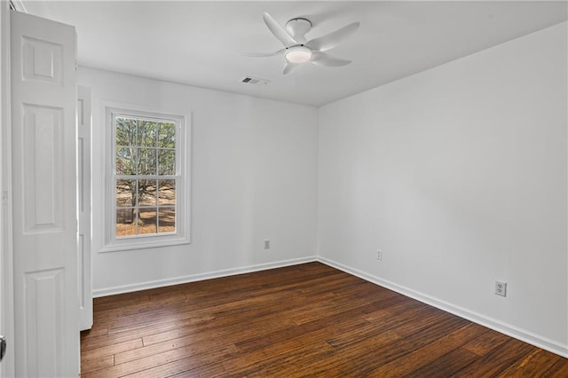 unfurnished room with visible vents, baseboards, ceiling fan, and dark wood-style flooring