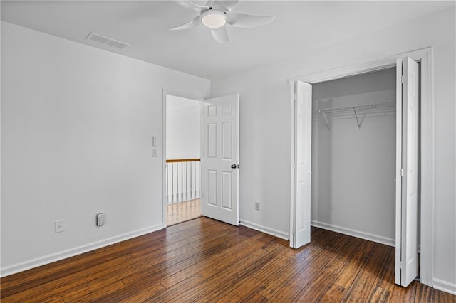 unfurnished bedroom with visible vents, baseboards, and hardwood / wood-style floors