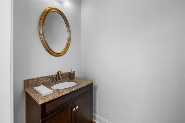 bathroom featuring vanity and baseboards