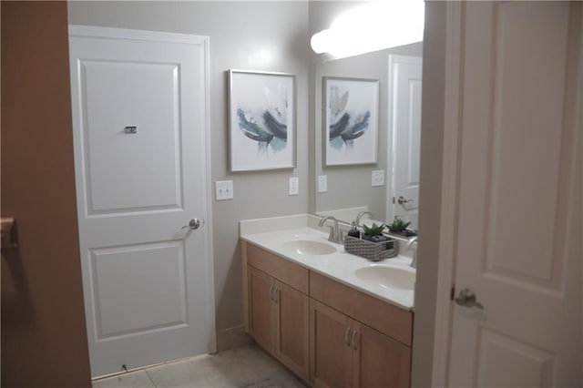 bathroom with tile patterned floors and vanity