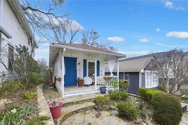 view of front of house with an outbuilding and a porch