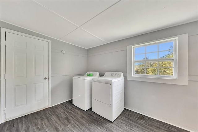 laundry area featuring independent washer and dryer and dark hardwood / wood-style flooring