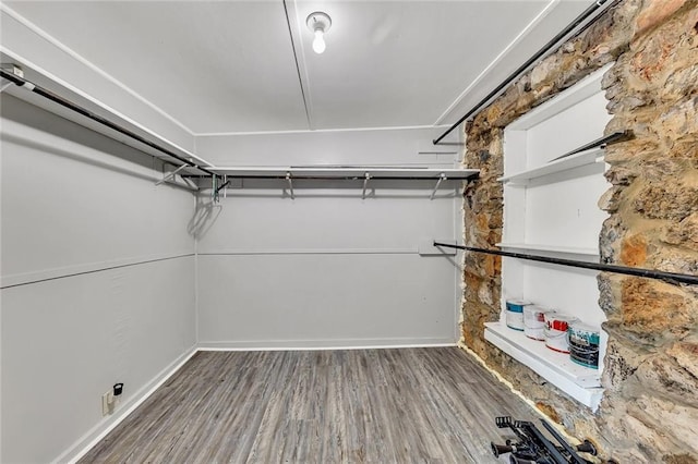 spacious closet featuring hardwood / wood-style floors