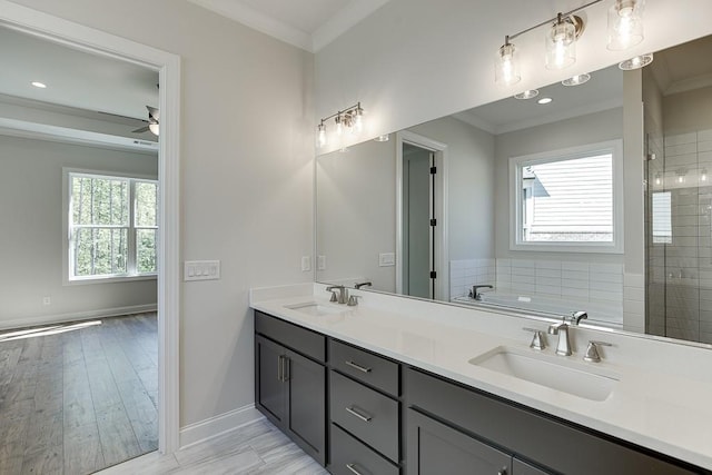 bathroom with ceiling fan, vanity, plus walk in shower, and ornamental molding