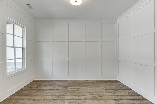 spare room with hardwood / wood-style flooring