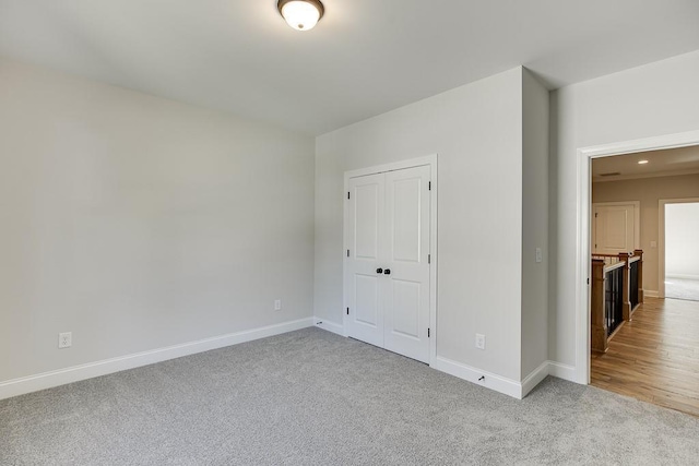 empty room featuring light carpet