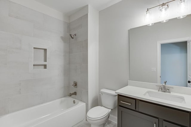 full bathroom with toilet, tiled shower / bath combo, and vanity