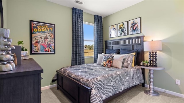 carpeted bedroom featuring visible vents and baseboards