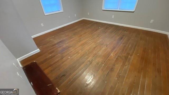 interior space featuring hardwood / wood-style floors and baseboards