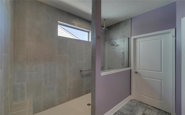 full bath with baseboards and walk in shower