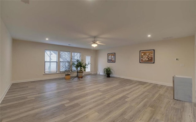 unfurnished living room featuring light wood finished floors, recessed lighting, a ceiling fan, and baseboards