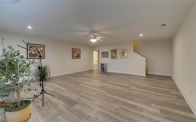 unfurnished living room featuring ceiling fan, recessed lighting, visible vents, baseboards, and light wood-type flooring