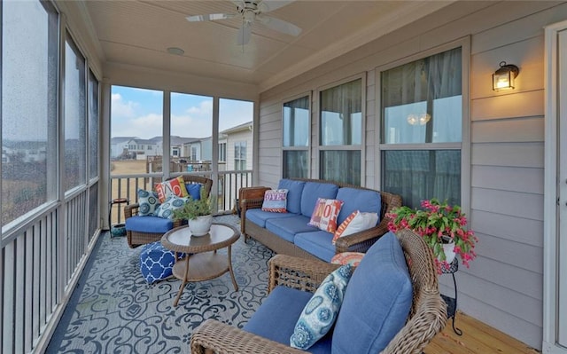 sunroom with ceiling fan