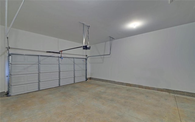 garage featuring baseboards and a garage door opener