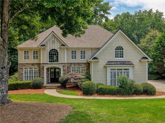3795 Newport Bay Dr, Alpharetta, GA 30005 - view of front of property featuring french doors, stone siding, a shingled roof, and a front lawn