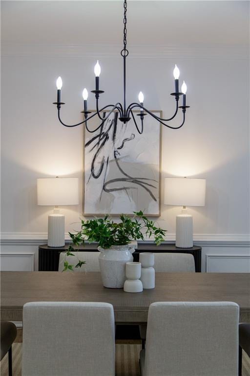3795 Newport Bay Dr, Alpharetta, GA 30005 - dining room featuring a chandelier, crown molding, a decorative wall, and wainscoting