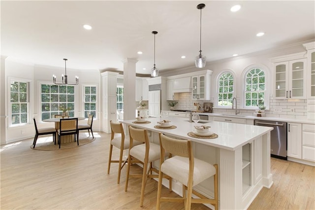 3795 Newport Bay Dr, Alpharetta, GA 30005 - kitchen featuring dishwasher, ornamental molding, decorative backsplash, light countertops, and glass insert cabinets