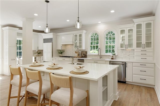 3795 Newport Bay Dr, Alpharetta, GA 30005 - kitchen with dishwasher, ornamental molding, decorative backsplash, a kitchen breakfast bar, and white cabinetry
