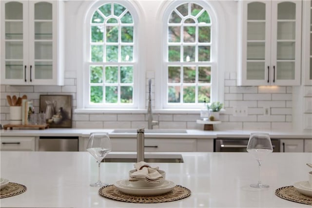 3795 Newport Bay Dr, Alpharetta, GA 30005 - kitchen featuring white cabinetry, light countertops, and healthy amount of natural light