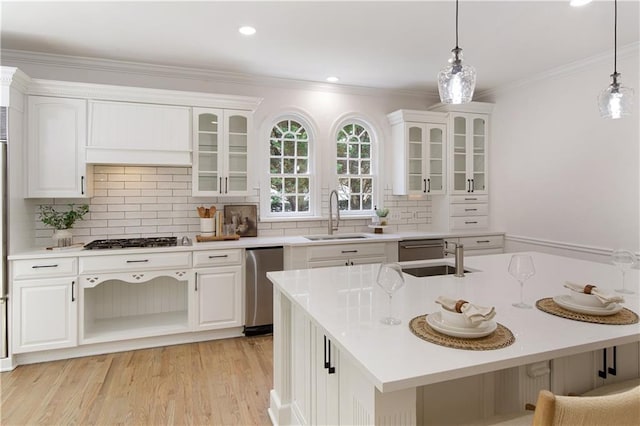 3795 Newport Bay Dr, Alpharetta, GA 30005 - kitchen featuring white cabinets, light countertops, hanging light fixtures, crown molding, and recessed lighting