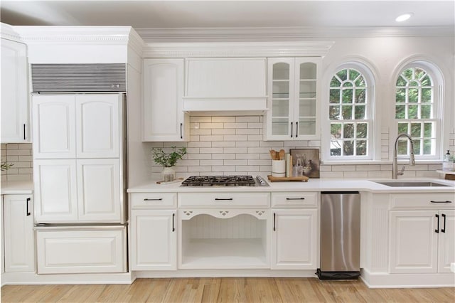 3795 Newport Bay Dr, Alpharetta, GA 30005 - kitchen featuring stainless steel gas cooktop, tasteful backsplash, paneled fridge, white cabinets, and light countertops