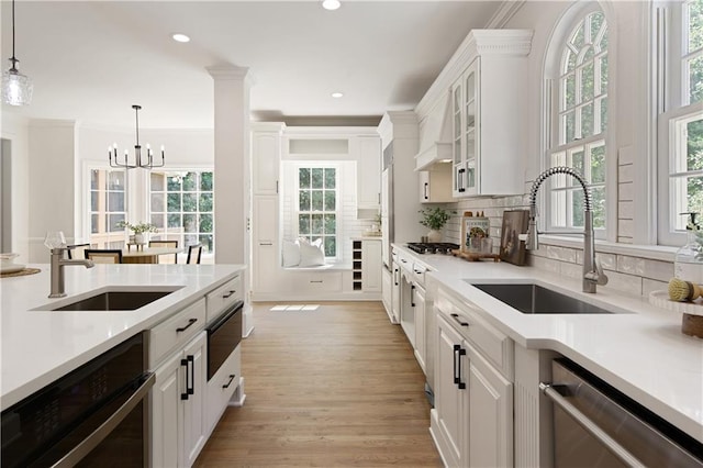 3795 Newport Bay Dr, Alpharetta, GA 30005 - kitchen featuring appliances with stainless steel finishes, white cabinetry, light countertops, a warming drawer, and recessed lighting