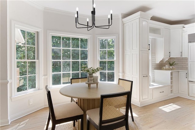 3795 Newport Bay Dr, Alpharetta, GA 30005 - dining room with a chandelier, light wood-style floors, plenty of natural light, and ornamental molding