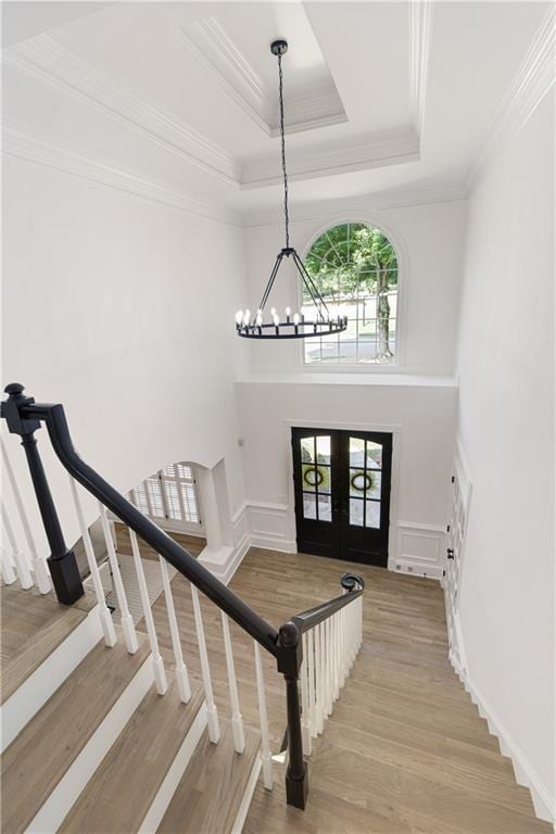 3795 Newport Bay Dr, Alpharetta, GA 30005 - foyer with french doors, stairs, a chandelier, wood finished floors, and a tray ceiling