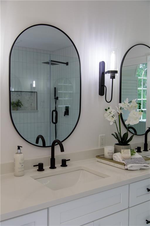 3795 Newport Bay Dr, Alpharetta, GA 30005 - full bathroom featuring vanity and a stall shower