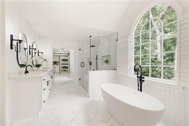 3795 Newport Bay Dr, Alpharetta, GA 30005 - full bath featuring a shower stall, double vanity, a soaking tub, and marble finish floors
