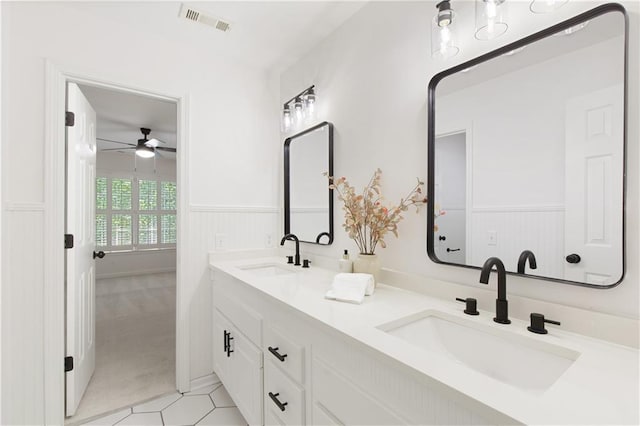 3795 Newport Bay Dr, Alpharetta, GA 30005 - full bathroom with ceiling fan, wainscoting, double vanity, and tile patterned flooring