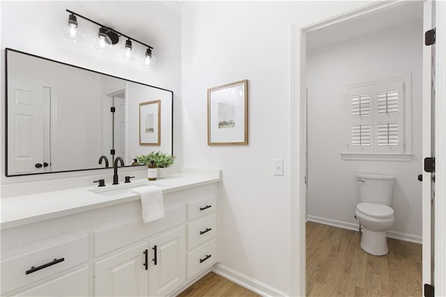 3795 Newport Bay Dr, Alpharetta, GA 30005 - bathroom with vanity, wood finished floors, and ornamental molding