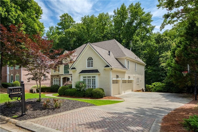 3795 Newport Bay Dr, Alpharetta, GA 30005 - view of front of house featuring decorative driveway, a garage, and roof with shingles