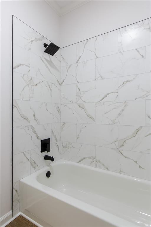 3795 Newport Bay Dr, Alpharetta, GA 30005 - bathroom with shower / bathtub combination and ornamental molding