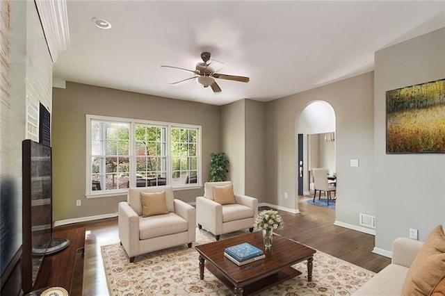 living room with ceiling fan and hardwood / wood-style floors