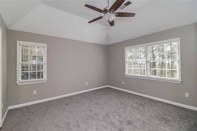 unfurnished room featuring carpet floors, lofted ceiling, and ceiling fan