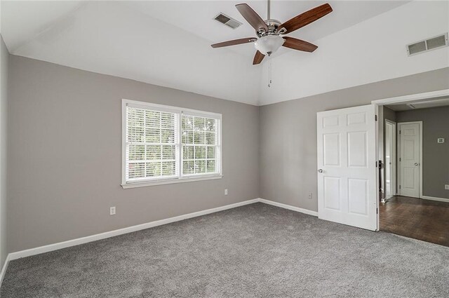 carpeted empty room featuring lofted ceiling and ceiling fan