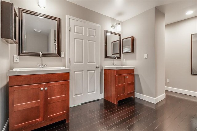 bathroom featuring hardwood / wood-style flooring and vanity