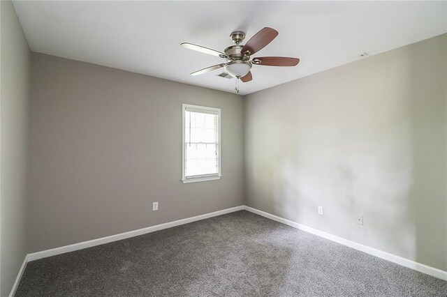 carpeted empty room with ceiling fan