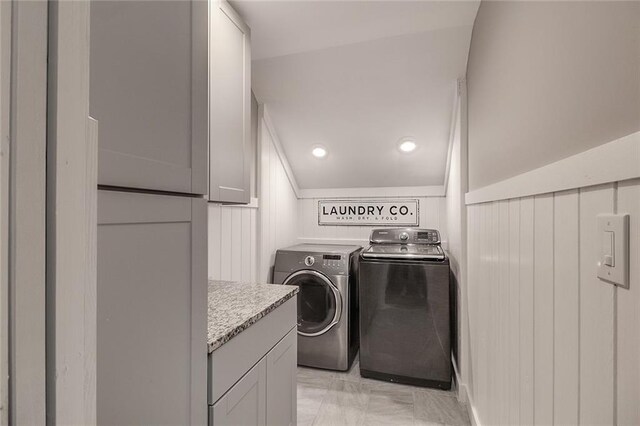 clothes washing area featuring separate washer and dryer