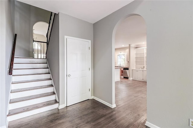 stairway featuring hardwood / wood-style flooring