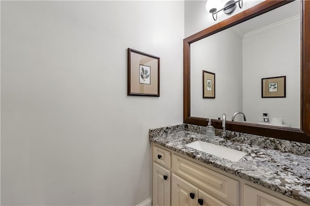 bathroom featuring crown molding and vanity