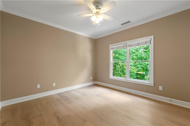 unfurnished room with crown molding, ceiling fan, and light hardwood / wood-style floors