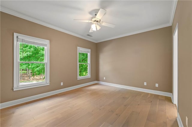 spare room featuring light wood-type flooring, crown molding, and ceiling fan